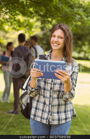 To use this stock image in your creative project, please select the size you need over to the right and click the "Add to Cart" button.
Your downloaded image will come with the Cutcaster watermark removed so don’t worry about the watermark you see on this page. Smiling student with a shoulder bag and using tablet computer stock photo, Smiling student with a shoulder bag and using tablet computer in park at school by Wavebreak Media