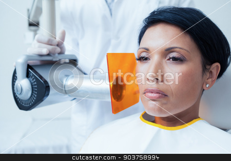 To use this stock image in your creative project, please select the size you need over to the right and click the "Add to Cart" button.
Your downloaded image will come with the Cutcaster watermark removed so don’t worry about the watermark you see on this page. Serious young woman undergoing dental checkup stock photo, Serious young woman undergoing dental checkup in the dentists chair by Wavebreak Media