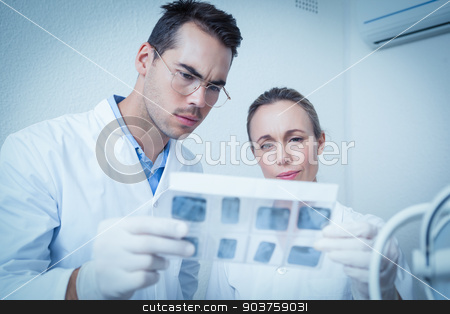 To use this stock image in your creative project, please select the size you need over to the right and click the "Add to Cart" button.
Your downloaded image will come with the Cutcaster watermark removed so don’t worry about the watermark you see on this page. Dentists looking at x-ray stock photo, Concentrated two dentists looking at x-ray by Wavebreak Media