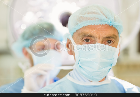 To use this stock image in your creative project, please select the size you need over to the right and click the "Add to Cart" button.
Your downloaded image will come with the Cutcaster watermark removed so don’t worry about the watermark you see on this page. Young surgeon tying older surgeons mask stock photo, Young surgeon tying older surgeons mask at the university by Wavebreak Media