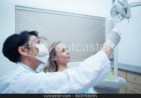 To use this stock image in your creative project, please select the size you need over to the right and click the "Add to Cart" button.
Your downloaded image will come with the Cutcaster watermark removed so don’t worry about the watermark you see on this page. Female dentist showing woman her mouth x-ray stock photo, Side view of female dentist showing woman her mouth x-ray by Wavebreak Media