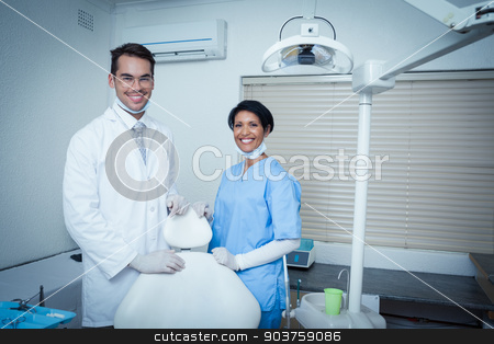 To use this stock image in your creative project, please select the size you need over to the right and click the "Add to Cart" button.
Your downloaded image will come with the Cutcaster watermark removed so don’t worry about the watermark you see on this page. Portrait of smiling dentists stock photo, Portrait of smiling male and female dentists by Wavebreak Media