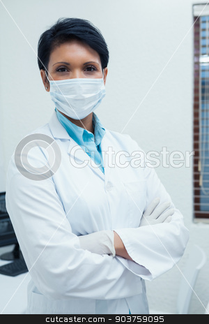 To use this stock image in your creative project, please select the size you need over to the right and click the "Add to Cart" button.
Your downloaded image will come with the Cutcaster watermark removed so don’t worry about the watermark you see on this page. Female dentist wearing surgical mask stock photo, Portrait of female dentist wearing surgical mask by Wavebreak Media