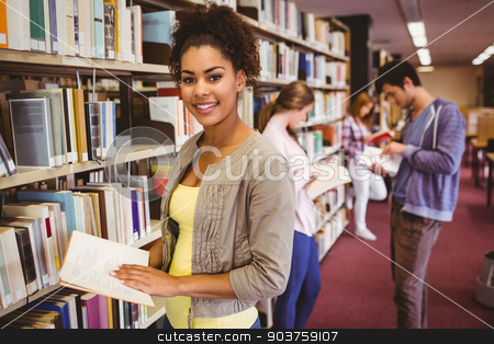 To use this stock image in your creative project, please select the size you need over to the right and click the "Add to Cart" button.
Your downloaded image will come with the Cutcaster watermark removed so don’t worry about the watermark you see on this page. Happy student taking book from shelf stock photo, Happy student taking book from shelf in library by Wavebreak Media