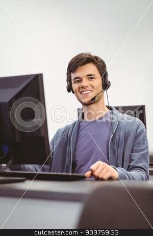 To use this stock image in your creative project, please select the size you need over to the right and click the "Add to Cart" button.
Your downloaded image will come with the Cutcaster watermark removed so don’t worry about the watermark you see on this page. Student sitting at the computer room wearing headset stock photo, Student sitting at the computer room wearing headset at the university by Wavebreak Media
