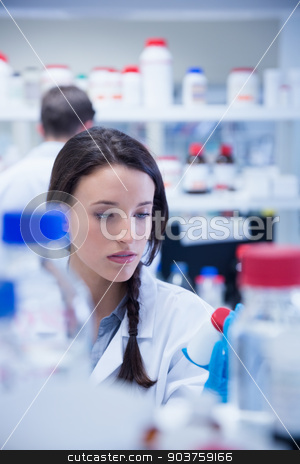 To use this stock image in your creative project, please select the size you need over to the right and click the "Add to Cart" button.
Your downloaded image will come with the Cutcaster watermark removed so don’t worry about the watermark you see on this page. Young chemist picking up the bottles on the shelf stock photo, Young chemist picking up the bottles on the shelf in lab by Wavebreak Media