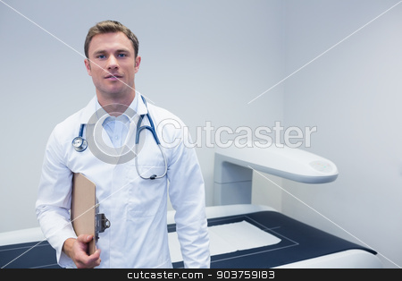 To use this stock image in your creative project, please select the size you need over to the right and click the "Add to Cart" button.
Your downloaded image will come with the Cutcaster watermark removed so don’t worry about the watermark you see on this page. Happy doctor smiling at camera holding clipboard stock photo, Happy doctor smiling at camera holding clipboard at medical office by Wavebreak Media