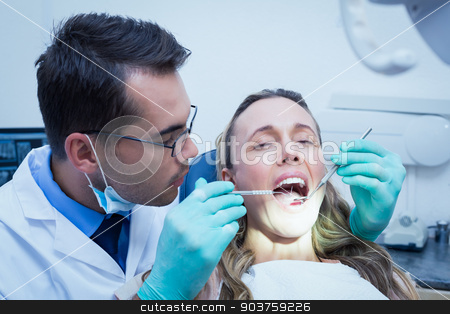 To use this stock image in your creative project, please select the size you need over to the right and click the "Add to Cart" button.
Your downloaded image will come with the Cutcaster watermark removed so don’t worry about the watermark you see on this page. Dentist examining young womans teeth stock photo, Dentist examining young womans teeth in the dentists chair by Wavebreak Media