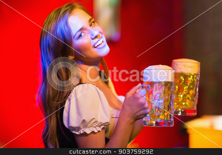 To use this stock image in your creative project, please select the size you need over to the right and click the "Add to Cart" button.
Your downloaded image will come with the Cutcaster watermark removed so don’t worry about the watermark you see on this page. Smiling oktoberfest barmaid with beer stock photo, Smiling oktoberfest barmaid with beer at the bar by Wavebreak Media
