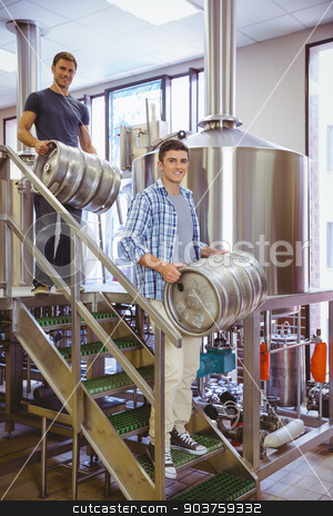 To use this stock image in your creative project, please select the size you need over to the right and click the "Add to Cart" button.
Your downloaded image will come with the Cutcaster watermark removed so don’t worry about the watermark you see on this page. Young men carrying keg smiling at camera stock photo, Young men carrying keg smiling at camera in the factory by Wavebreak Media