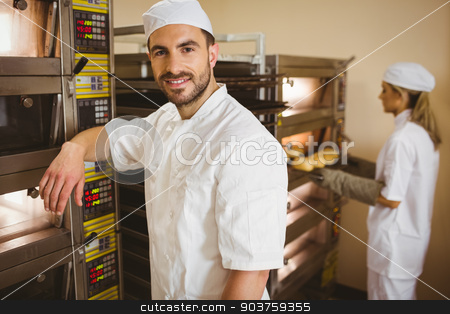 To use this stock image in your creative project, please select the size you need over to the right and click the "Add to Cart" button.
Your downloaded image will come with the Cutcaster watermark removed so don’t worry about the watermark you see on this page. Handsome baker smiling at camera stock photo, Handsome baker smiling at camera in a commercial kitchen by Wavebreak Media
