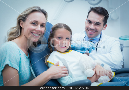 To use this stock image in your creative project, please select the size you need over to the right and click the "Add to Cart" button.
Your downloaded image will come with the Cutcaster watermark removed so don’t worry about the watermark you see on this page. Dentist examining girls teeth with assistant stock photo, Dentist examining girls teeth in the dentists chair with assistant by Wavebreak Media