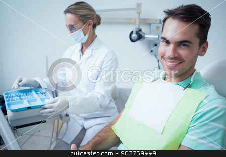 To use this stock image in your creative project, please select the size you need over to the right and click the "Add to Cart" button.
Your downloaded image will come with the Cutcaster watermark removed so don’t worry about the watermark you see on this page. Smiling man waiting for dental exam stock photo, Portrait of smiling young man waiting for a dental exam by Wavebreak Media