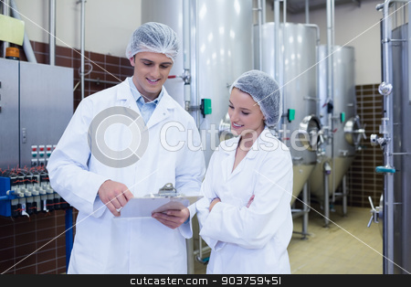 To use this stock image in your creative project, please select the size you need over to the right and click the "Add to Cart" button.
Your downloaded image will come with the Cutcaster watermark removed so don’t worry about the watermark you see on this page. Scientist speaking to his colleague holding clipboard stock photo, Scientist speaking to his colleague holding clipboard in the factory by Wavebreak Media
