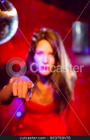 To use this stock image in your creative project, please select the size you need over to the right and click the "Add to Cart" button.
Your downloaded image will come with the Cutcaster watermark removed so don’t worry about the watermark you see on this page. Pretty brunette dancing and pointing stock photo, Pretty brunette dancing and pointing at the nightclub by Wavebreak Media