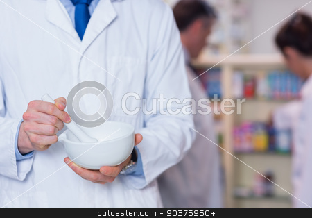 To use this stock image in your creative project, please select the size you need over to the right and click the "Add to Cart" button.
Your downloaded image will come with the Cutcaster watermark removed so don’t worry about the watermark you see on this page. Close up of a pharmacist using mortar and pestle stock photo, Close up of a pharmacist using mortar and pestle in the pharmacy by Wavebreak Media