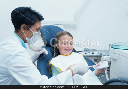 To use this stock image in your creative project, please select the size you need over to the right and click the "Add to Cart" button.
Your downloaded image will come with the Cutcaster watermark removed so don’t worry about the watermark you see on this page. Female dentist teaching girl how to brush teeth stock photo, Female dentist teaching girl how to brush teeth in the dentists chair by Wavebreak Media
