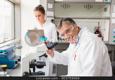To use this stock image in your creative project, please select the size you need over to the right and click the "Add to Cart" button.
Your downloaded image will come with the Cutcaster watermark removed so don’t worry about the watermark you see on this page. Team of scientists at work stock photo, Team of scientists at work at the laboratory by Wavebreak Media