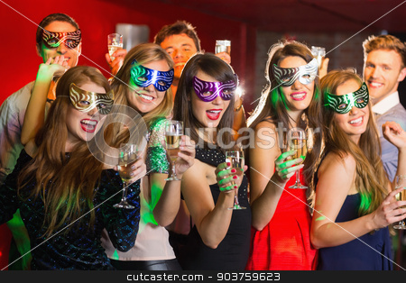 To use this stock image in your creative project, please select the size you need over to the right and click the "Add to Cart" button.
Your downloaded image will come with the Cutcaster watermark removed so don’t worry about the watermark you see on this page. Friends in masquerade masks drinking champagne stock photo, Friends in masquerade masks drinking champagne at the nightclub by Wavebreak Media