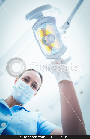 To use this stock image in your creative project, please select the size you need over to the right and click the "Add to Cart" button.
Your downloaded image will come with the Cutcaster watermark removed so don’t worry about the watermark you see on this page. Female dentist adjusting light stock photo, Low angle portrait of female dentist adjusting light by Wavebreak Media