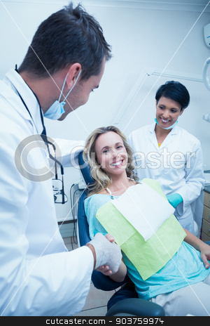 To use this stock image in your creative project, please select the size you need over to the right and click the "Add to Cart" button.
Your downloaded image will come with the Cutcaster watermark removed so don’t worry about the watermark you see on this page. Dentist with assistant shaking hands with woman stock photo, Male dentist with assistant shaking hands with woman in the dentists chair by Wavebreak Media