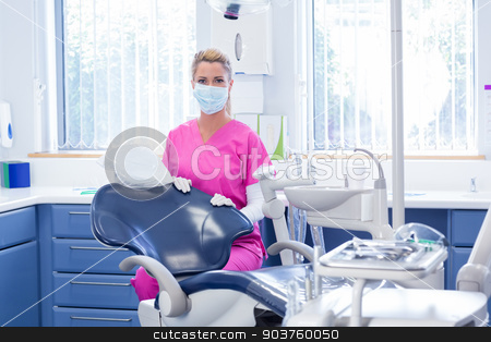 To use this stock image in your creative project, please select the size you need over to the right and click the "Add to Cart" button.
Your downloaded image will come with the Cutcaster watermark removed so don’t worry about the watermark you see on this page. Dentist in mask looking at camera beside chair stock photo, Dentist in mask looking at camera beside chair at the dental clinic by Wavebreak Media