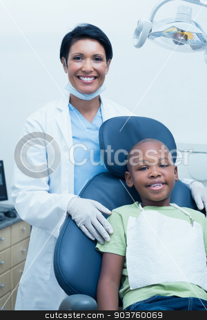 To use this stock image in your creative project, please select the size you need over to the right and click the "Add to Cart" button.
Your downloaded image will come with the Cutcaster watermark removed so don’t worry about the watermark you see on this page. Portrait of female dentist examining boys teeth stock photo, Portrait of female dentist examining boys teeth in the dentists chair by Wavebreak Media