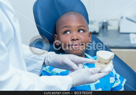 To use this stock image in your creative project, please select the size you need over to the right and click the "Add to Cart" button.
Your downloaded image will come with the Cutcaster watermark removed so don’t worry about the watermark you see on this page. Cropped dentist showing boy prosthesis teeth stock photo, Cropped dentist showing young boy prosthesis teeth in the dentists chair by Wavebreak Media