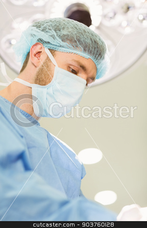 To use this stock image in your creative project, please select the size you need over to the right and click the "Add to Cart" button.
Your downloaded image will come with the Cutcaster watermark removed so don’t worry about the watermark you see on this page. Young surgeon wearing mask and cap stock photo, Young surgeon wearing mask and cap at the university by Wavebreak Media