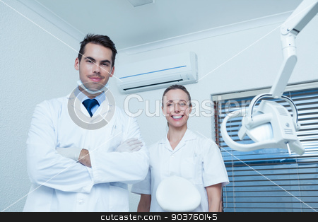 To use this stock image in your creative project, please select the size you need over to the right and click the "Add to Cart" button.
Your downloaded image will come with the Cutcaster watermark removed so don’t worry about the watermark you see on this page. Portrait of smiling dentists stock photo, Portrait of smiling male and female dentists by Wavebreak Media
