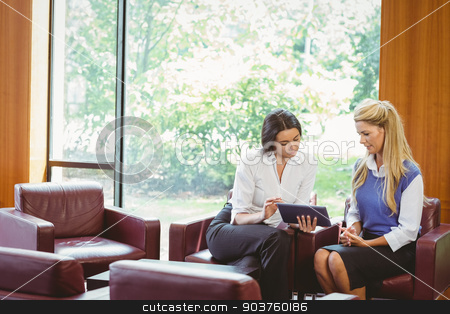 To use this stock image in your creative project, please select the size you need over to the right and click the "Add to Cart" button.
Your downloaded image will come with the Cutcaster watermark removed so don’t worry about the watermark you see on this page. Businesswomen having a meeting and using tablet stock photo, Businesswomen having a meeting and using tablet in the office by Wavebreak Media