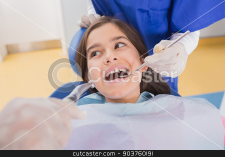 To use this stock image in your creative project, please select the size you need over to the right and click the "Add to Cart" button.
Your downloaded image will come with the Cutcaster watermark removed so don’t worry about the watermark you see on this page. Dentist and his dental assistant examining a young patient stock photo, Dentist and his dental assistant examining a young patient in dental clinic by Wavebreak Media