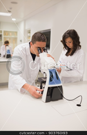 To use this stock image in your creative project, please select the size you need over to the right and click the "Add to Cart" button.
Your downloaded image will come with the Cutcaster watermark removed so don’t worry about the watermark you see on this page. Medical students working with microscope stock photo, Medical students working with microscope at the university by Wavebreak Media