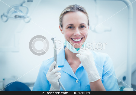 To use this stock image in your creative project, please select the size you need over to the right and click the "Add to Cart" button.
Your downloaded image will come with the Cutcaster watermark removed so don’t worry about the watermark you see on this page. Female dentist holding dental tool stock photo, Portrait of smiling young female dentist holding dental tool by Wavebreak Media