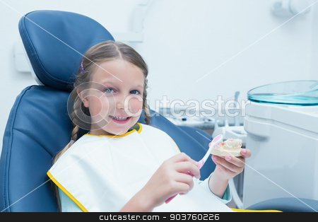 To use this stock image in your creative project, please select the size you need over to the right and click the "Add to Cart" button.
Your downloaded image will come with the Cutcaster watermark removed so don’t worry about the watermark you see on this page. Little girl learning how to brush teeth stock photo, Little girl learning how to brush teeth in the dentists chair by Wavebreak Media