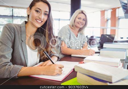 To use this stock image in your creative project, please select the size you need over to the right and click the "Add to Cart" button.
Your downloaded image will come with the Cutcaster watermark removed so don’t worry about the watermark you see on this page. Smiling matures females students writing notes at desk stock photo, Smiling matures females students writing notes at desk in library by Wavebreak Media