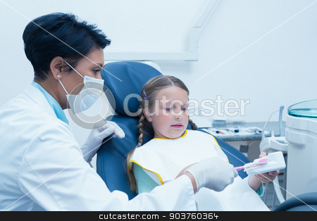 To use this stock image in your creative project, please select the size you need over to the right and click the "Add to Cart" button.
Your downloaded image will come with the Cutcaster watermark removed so don’t worry about the watermark you see on this page. Female dentist teaching girl how to brush teeth stock photo, Female dentist teaching girl how to brush teeth in the dentists chair by Wavebreak Media