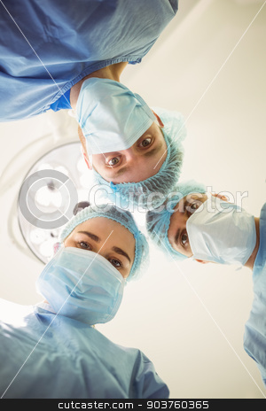 To use this stock image in your creative project, please select the size you need over to the right and click the "Add to Cart" button.
Your downloaded image will come with the Cutcaster watermark removed so don’t worry about the watermark you see on this page. Young surgeons looking down at camera stock photo, Young surgeons looking down at camera at the university by Wavebreak Media