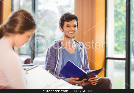 To use this stock image in your creative project, please select the size you need over to the right and click the "Add to Cart" button.
Your downloaded image will come with the Cutcaster watermark removed so don’t worry about the watermark you see on this page. Students sitting on couch revising and smiling at camera stock photo, Students sitting on couch revising and smiling at camera at the university by Wavebreak Media