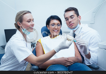 To use this stock image in your creative project, please select the size you need over to the right and click the "Add to Cart" button.
Your downloaded image will come with the Cutcaster watermark removed so don’t worry about the watermark you see on this page. Dentists showing woman prosthesis teeth stock photo, Female dentist with assistant showing woman prosthesis teeth by Wavebreak Media