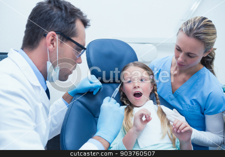 To use this stock image in your creative project, please select the size you need over to the right and click the "Add to Cart" button.
Your downloaded image will come with the Cutcaster watermark removed so don’t worry about the watermark you see on this page. Dentist with assistant examining girls teeth stock photo, Dentist with assistant examining girls teeth in the dentists chair by Wavebreak Media
