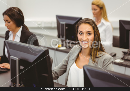 To use this stock image in your creative project, please select the size you need over to the right and click the "Add to Cart" button.
Your downloaded image will come with the Cutcaster watermark removed so don’t worry about the watermark you see on this page. Smiling businesswoman working in computer room stock photo, Smiling businesswoman working in computer room in the office by Wavebreak Media