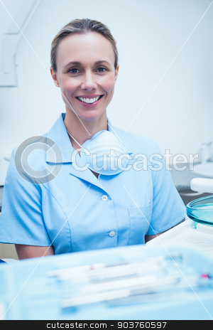 To use this stock image in your creative project, please select the size you need over to the right and click the "Add to Cart" button.
Your downloaded image will come with the Cutcaster watermark removed so don’t worry about the watermark you see on this page. Portrait of smiling female dentist stock photo, Close up portrait of smiling young female dentist by Wavebreak Media