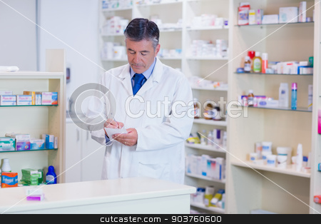 To use this stock image in your creative project, please select the size you need over to the right and click the "Add to Cart" button.
Your downloaded image will come with the Cutcaster watermark removed so don’t worry about the watermark you see on this page. Focused pharmacist writing down notes stock photo, Focused pharmacist writing down notes in the pharmacy by Wavebreak Media