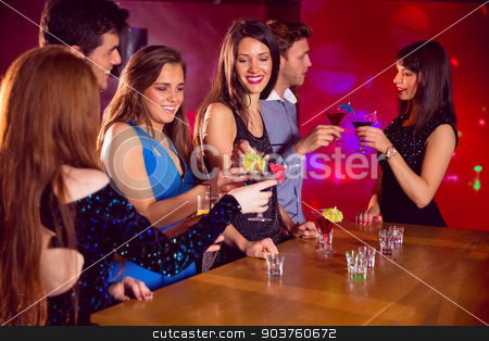 To use this stock image in your creative project, please select the size you need over to the right and click the "Add to Cart" button.
Your downloaded image will come with the Cutcaster watermark removed so don’t worry about the watermark you see on this page. Happy friends on a night out together stock photo, Happy friends on a night out together at the nightclub by Wavebreak Media