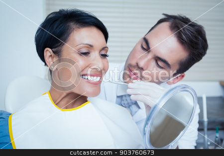To use this stock image in your creative project, please select the size you need over to the right and click the "Add to Cart" button.
Your downloaded image will come with the Cutcaster watermark removed so don’t worry about the watermark you see on this page. Male dentist examining womans teeth stock photo, Male dentist examining womans teeth in the dentists chair by Wavebreak Media