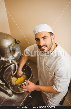 To use this stock image in your creative project, please select the size you need over to the right and click the "Add to Cart" button.
Your downloaded image will come with the Cutcaster watermark removed so don’t worry about the watermark you see on this page. Baker using large mixer to mix dough stock photo, Baker using large mixer to mix dough in a commercial kitchen by Wavebreak Media