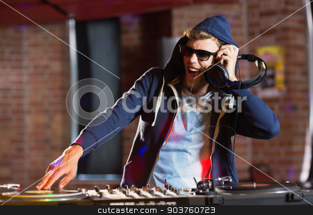 To use this stock image in your creative project, please select the size you need over to the right and click the "Add to Cart" button.
Your downloaded image will come with the Cutcaster watermark removed so don’t worry about the watermark you see on this page. Cool dj spinning the decks stock photo, Cool dj spinning the decks at the nightclub by Wavebreak Media