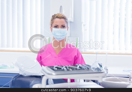 To use this stock image in your creative project, please select the size you need over to the right and click the "Add to Cart" button.
Your downloaded image will come with the Cutcaster watermark removed so don’t worry about the watermark you see on this page. Dentist in mask wearing pink scrubs and looking at camera stock photo, Dentist in mask wearing pink scrubs and looking at camera at the dental clinic by Wavebreak Media