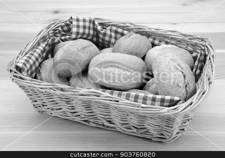 To use this stock image in your creative project, please select the size you need over to the right and click the "Add to Cart" button.
Your downloaded image will come with the Cutcaster watermark removed so don’t worry about the watermark you see on this page. Basket full of fresh bread rolls stock photo, Wicker basket full of crusty bread rolls on a wooden table - monochrome processing by Sarah Marchant